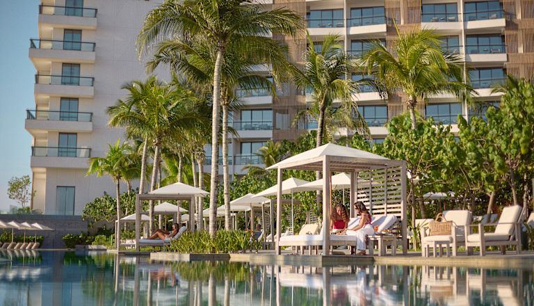 Exterior shot of Waldorf hotel with pool