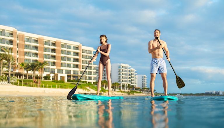 guests on paddle boards in the water