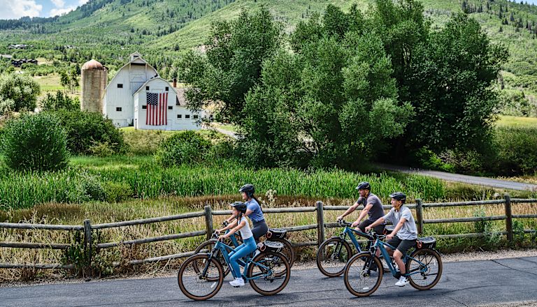 A Group of People Riding Bicycles Outdoors
