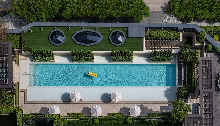outdoor pool aerial view with guest