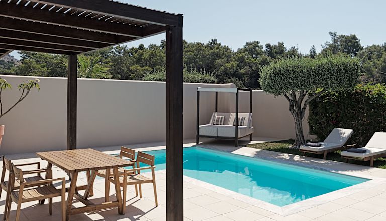 Private Pool and Terrace with a Table and Chairs in a Hotel Suite