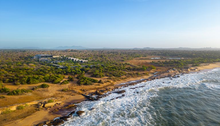 Aerial exterior shot of hotel with beach