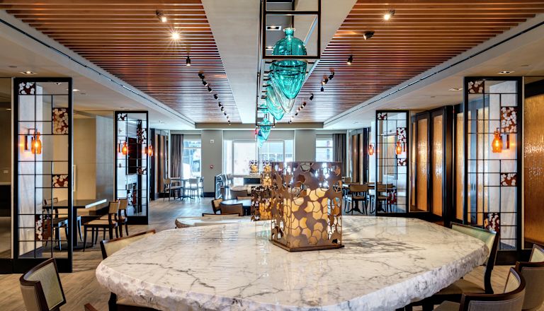 Image of breakfast area showing buffet with fresh fruit and other breakfast options