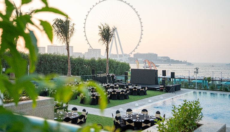 Round Tables Set for an Event in a Garden