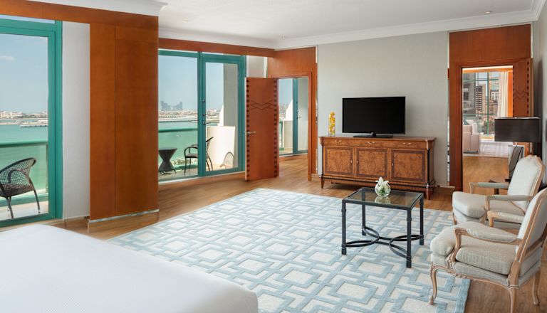Royal Suite Bedroom with Seating Area and Balcony with Sea View
