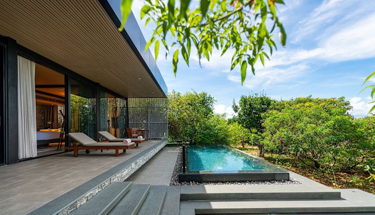 Outdoor Pool Area with Lounge Chairs in a Suite