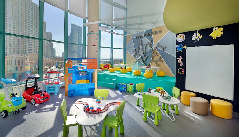 View of Kids Club with Toys and Small Tables and Chairs