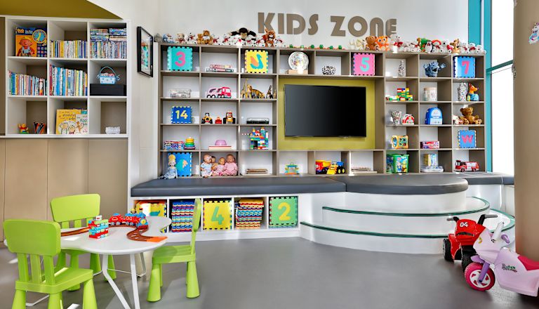 View of Kids Zone with Toys Books and Television