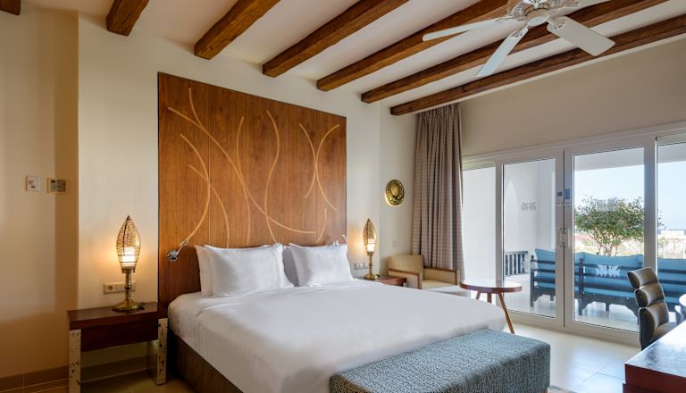 Large Bed in a Suite with Balcony