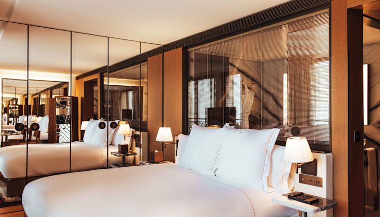 King size bed with mirrored wardrobe in background