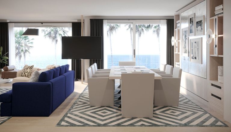 Mesa de reunião na sala com cadeiras e área de lounge
