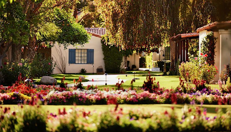 Exterior shot with gardens and flowers