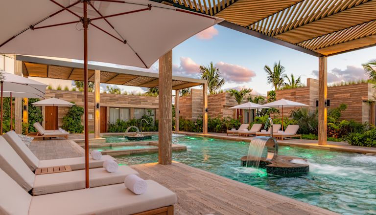 outdoor pool with lounge chairs