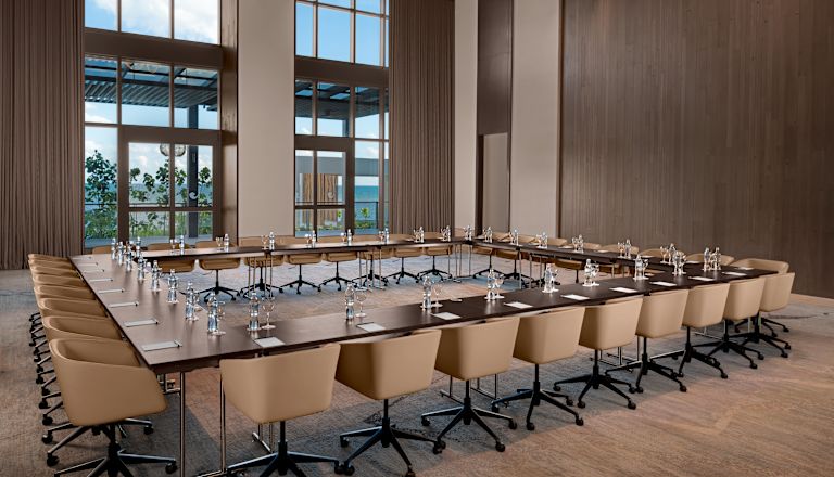 meeting room with square shaped table setup and chairs