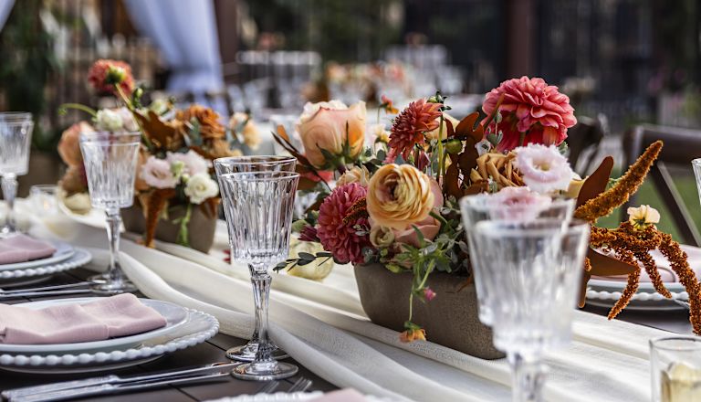 Flowers on a Dining Table To Celebrate a Special Event Outdoors