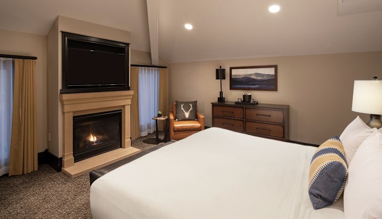 Bed in room with TV