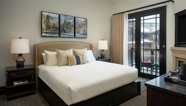 Bed in room with TV
