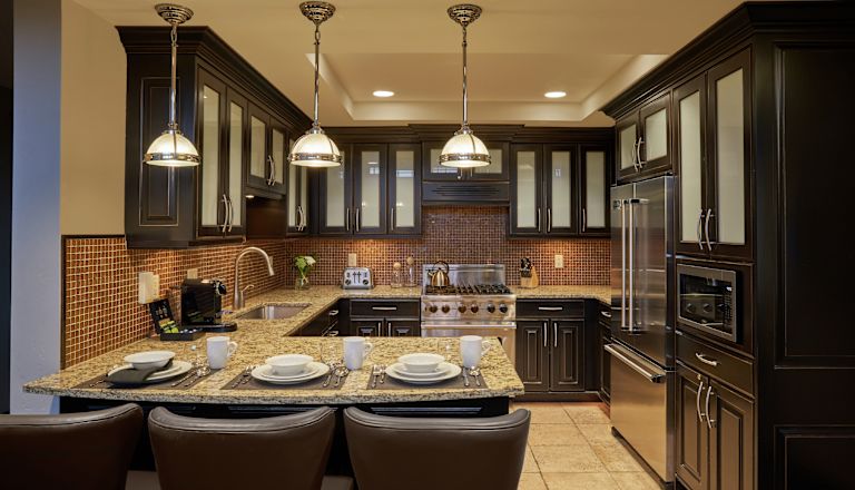Kitchen area with crockery and chairs