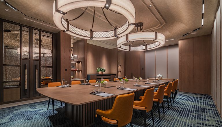 Meeting Room with Long Table and Orange Chairs