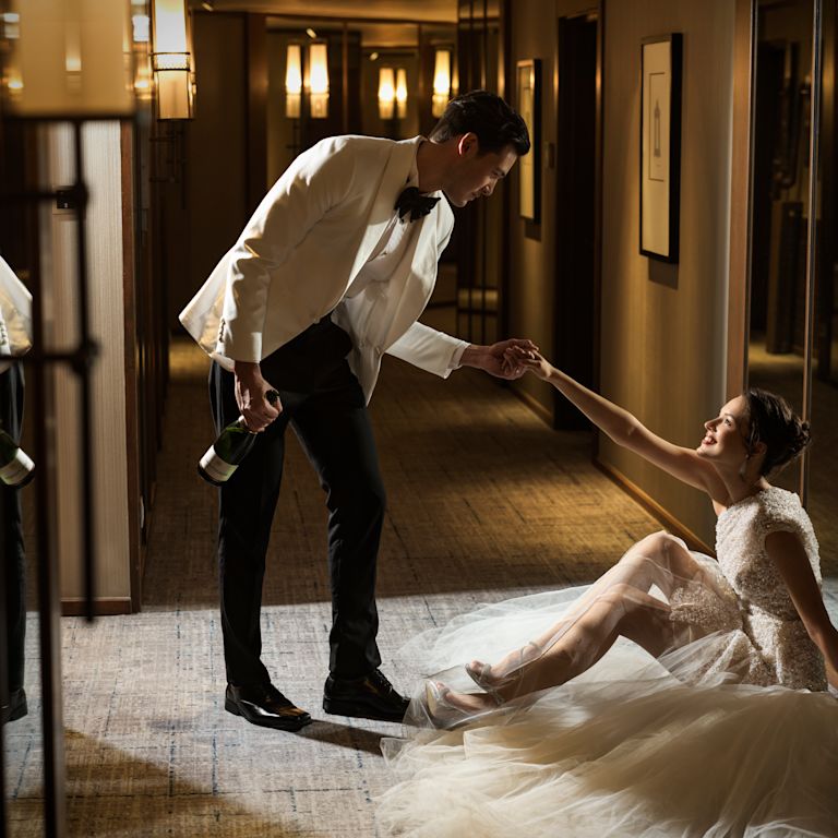 Couple Holding Hands on Their Wedding Day