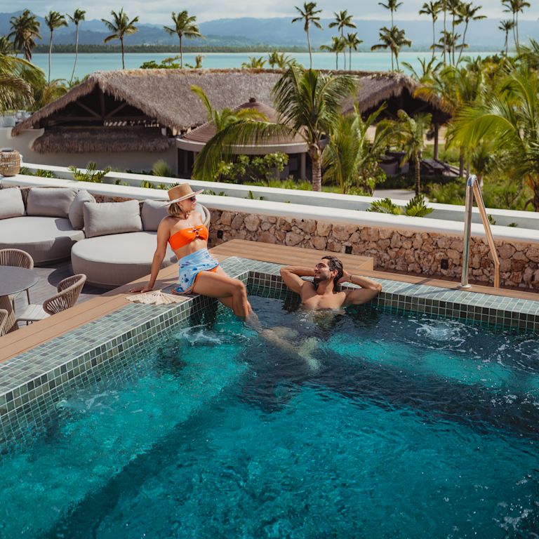 A couple enjoying the hot tub.