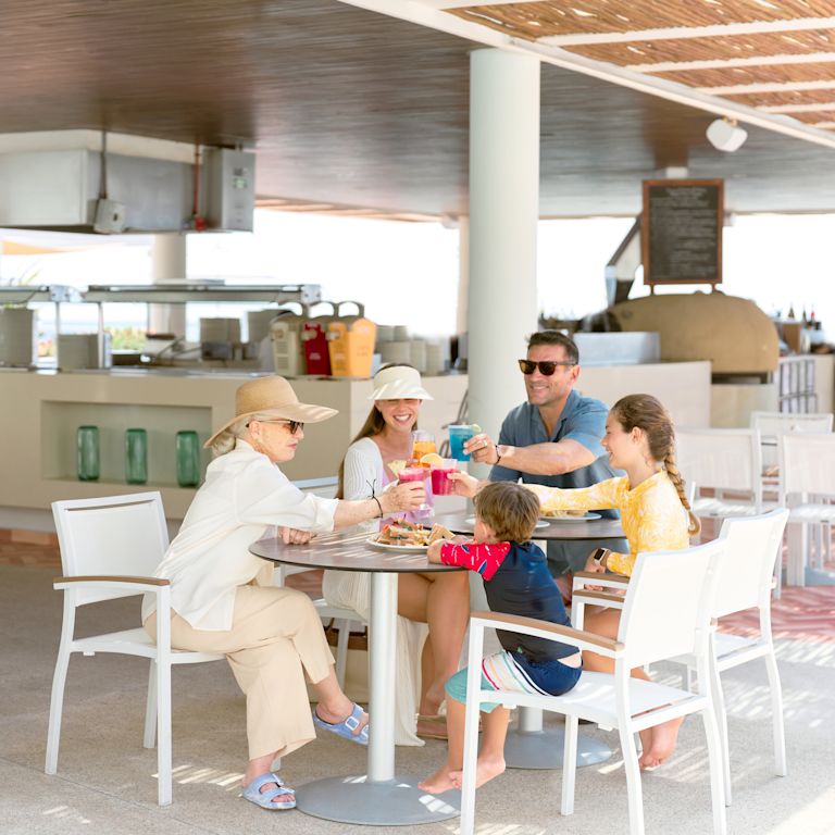 Family dining on a terrace at Seasalt restaurant