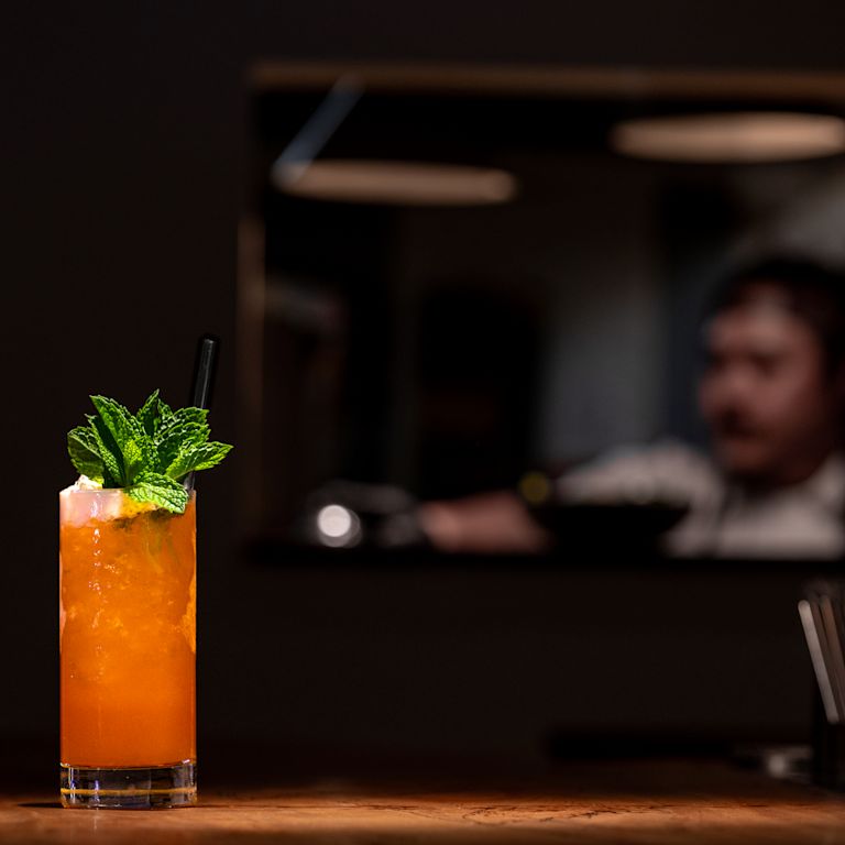 Bartender and a cocktail at Kin Khao bar