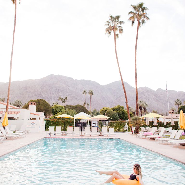 Woman relaxing in front of pool