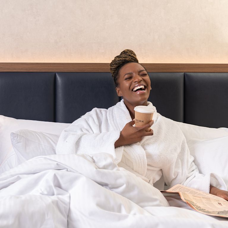 Lady Enjoying Guestroom