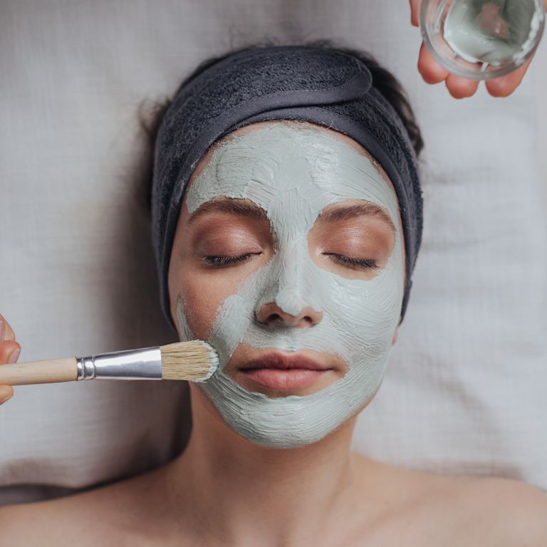 Woman receiving facial