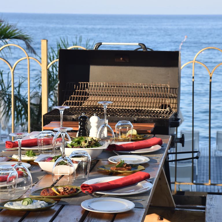 Dining Outdoors by the Water at BBQ Restaurant
