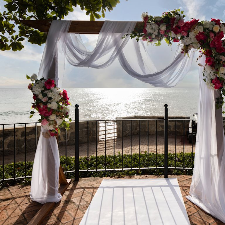 Wedding archway overlooking ocean