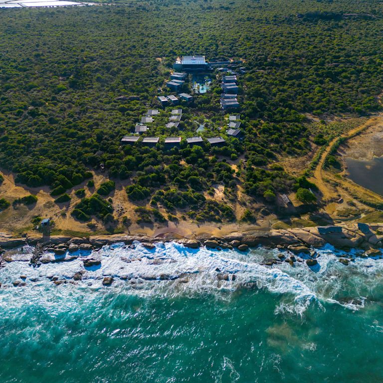 Aerial View of Hotel Exterior by the Beach