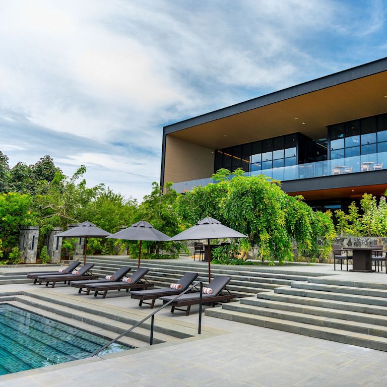Outdoor Pool Area with Lounge Chairs