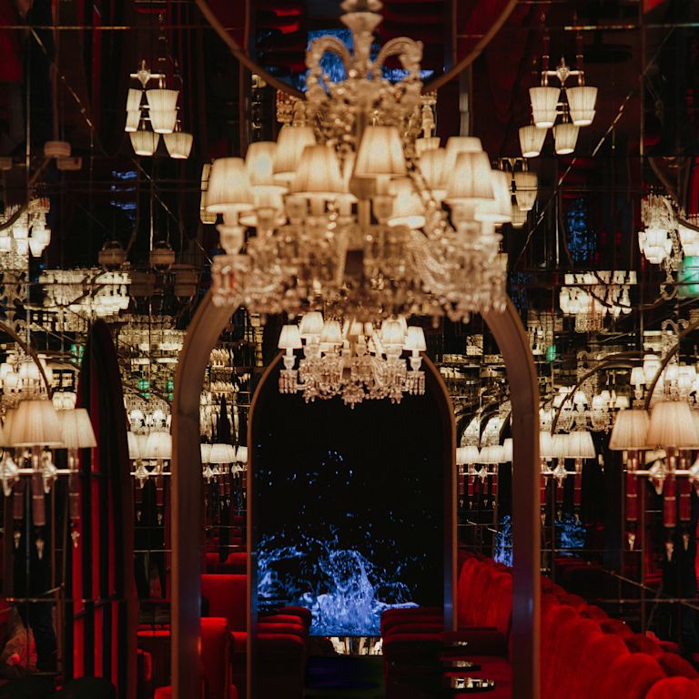Bar with round tables and velvet sofas