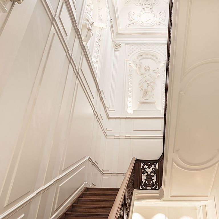 Stairs and View of Wall Sculptures