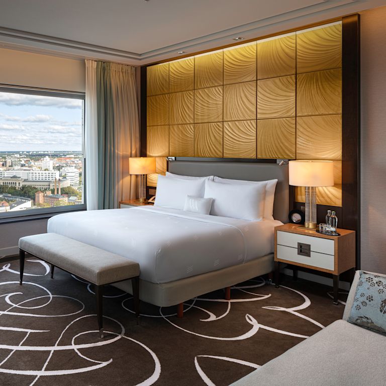 Bed in room with lamps