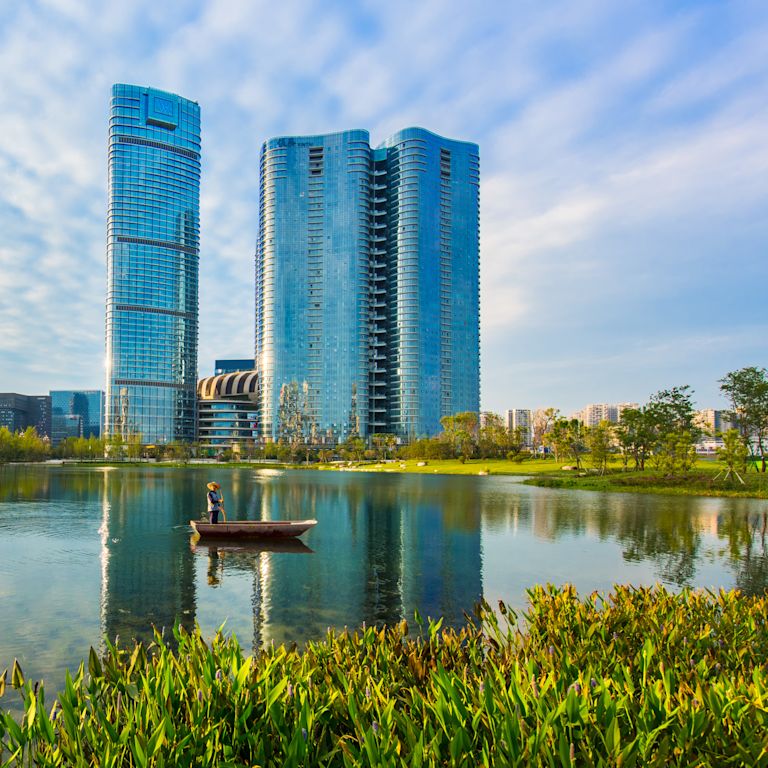 View of Hotel Building Exterior and Reflection on Water