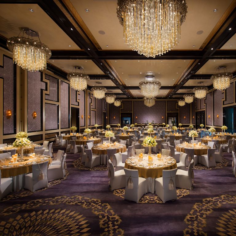 Spacious Ballroom Area with Round Tables and Chairs