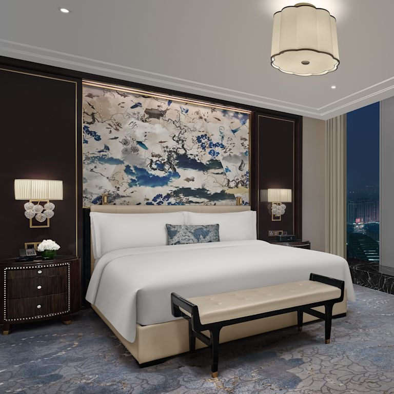 guest room, 1 king bed, lounge chair, window view of the city at night