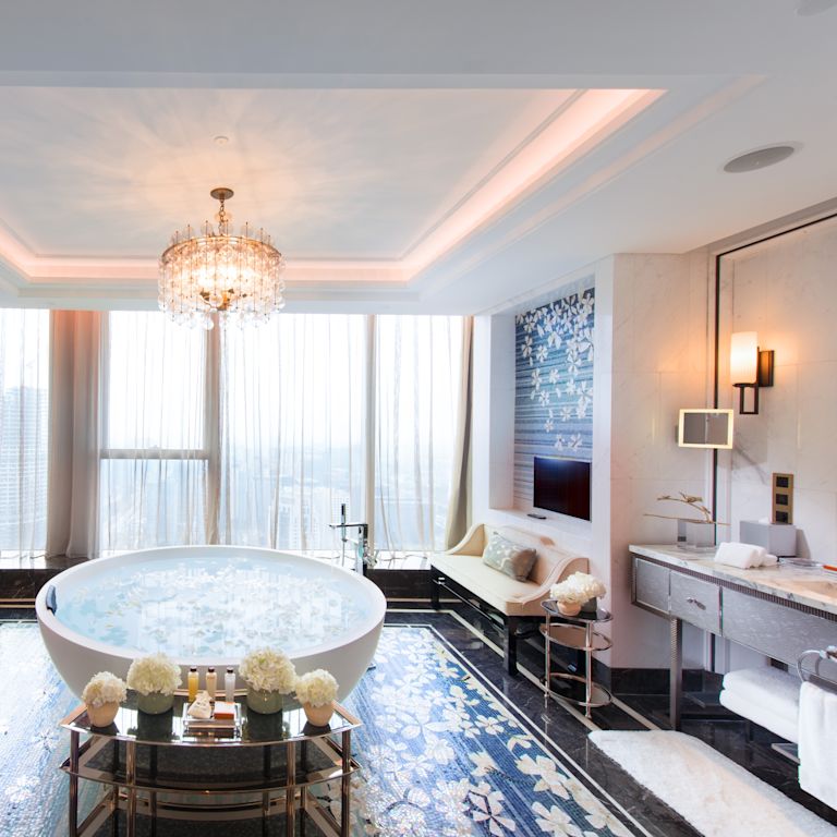 Suite Bathroom with Tub, Two Vanities, Two Sofas and Wall Mounted HDTV