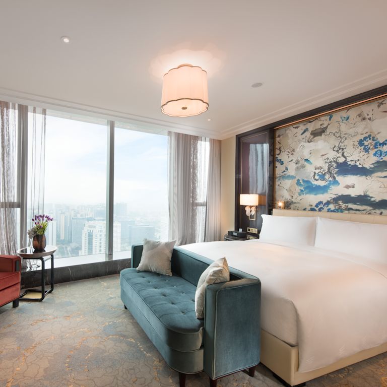 One King Bed Guest Bedroom with Sofa, Armchair and HDTV