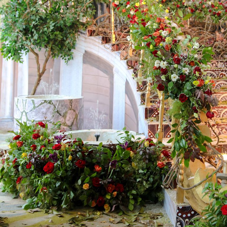 an area decorated with flowers for a wedding