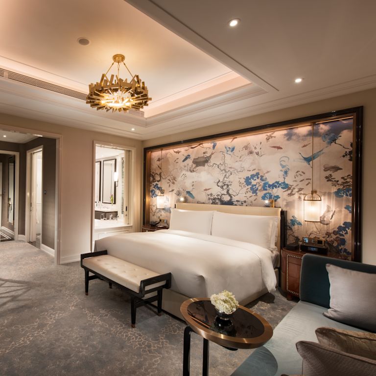 One King Bed Guest Bedroom with Sofa and Armchair