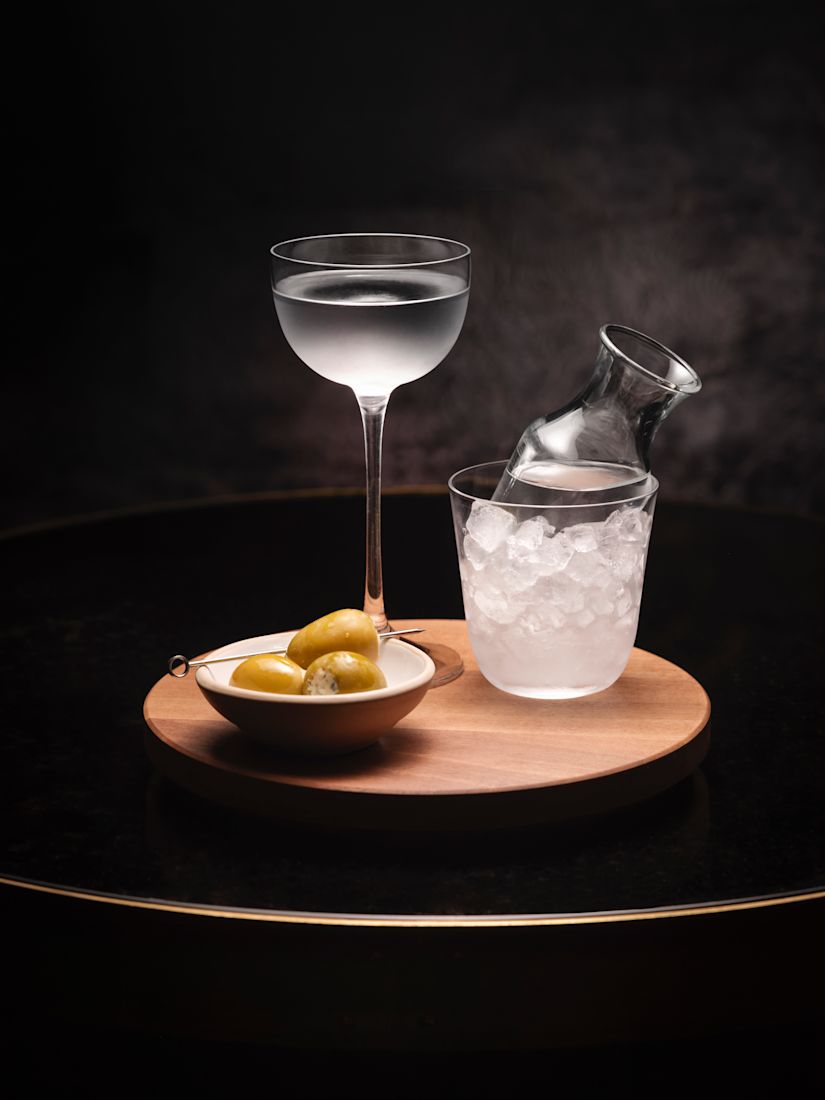 Cocktail on table with dark background in Twenty8 NoMad-next-transition