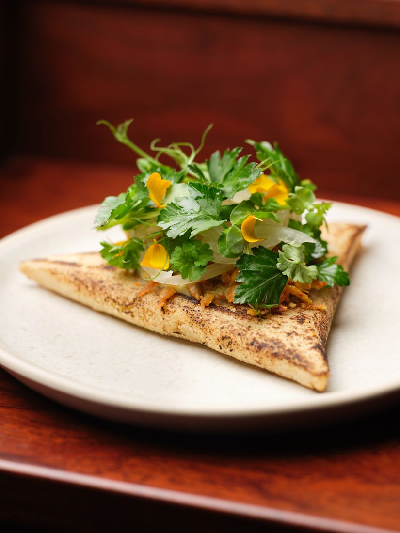 Tetela on a plate with salad-previous-transition