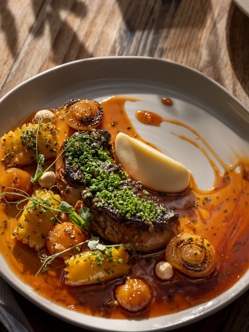 Steak Dish with Red Sauce on a Plate at Signature Restaurant-transition