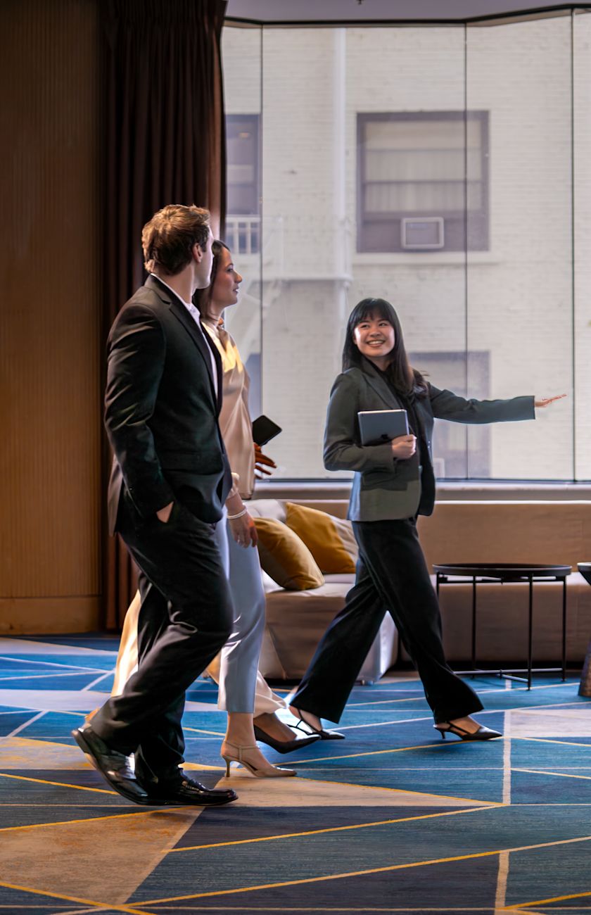 Meeting planner with clients in foyer area