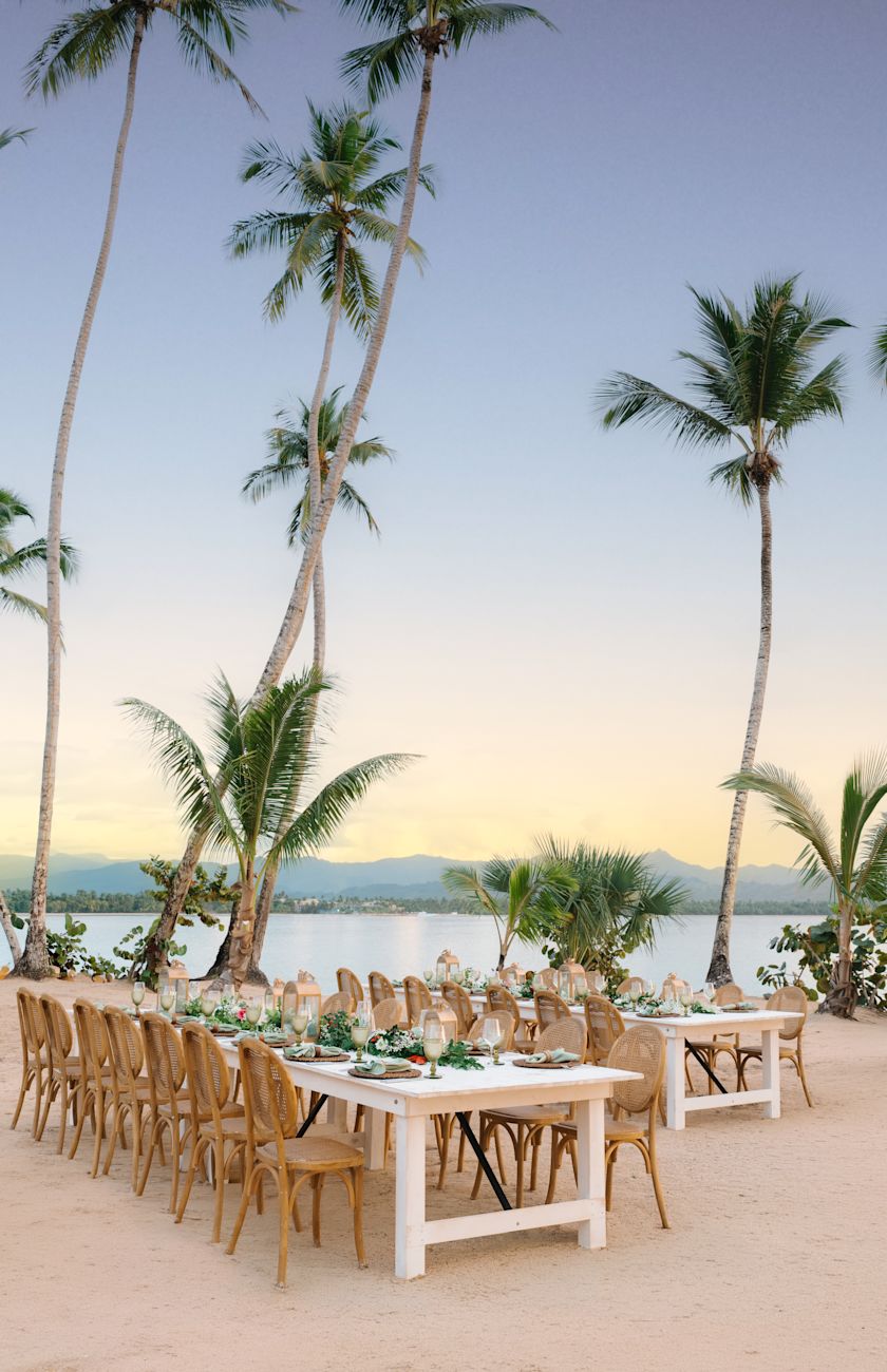 Dining table set on the beach with ocean view