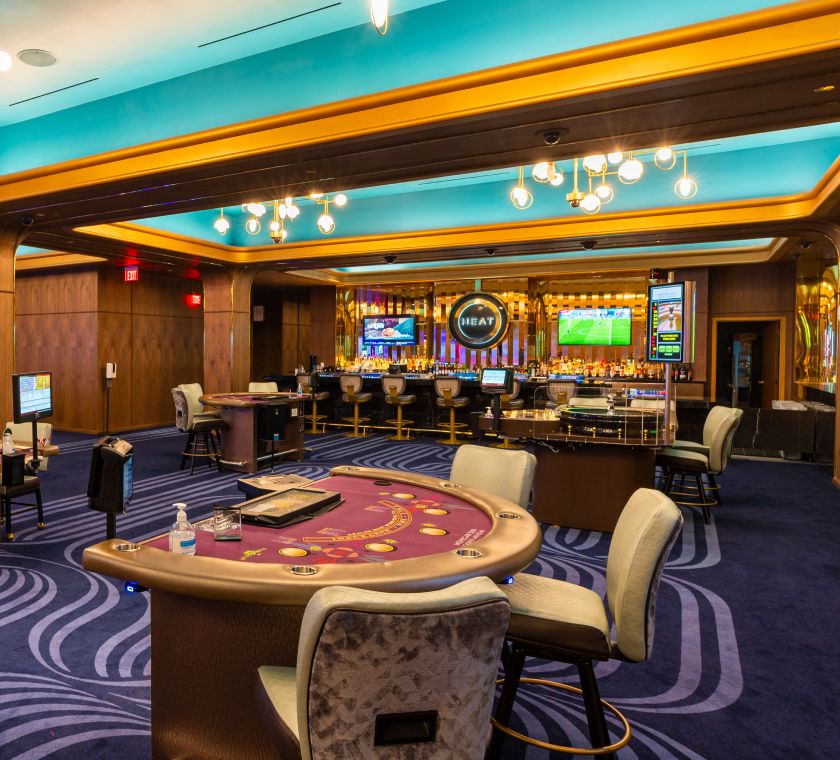 Casino interior with gaming machines and tables